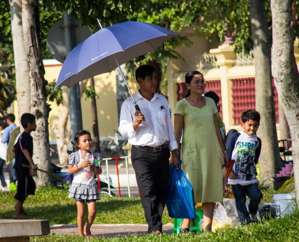 A family walks through Wat Bottom Park