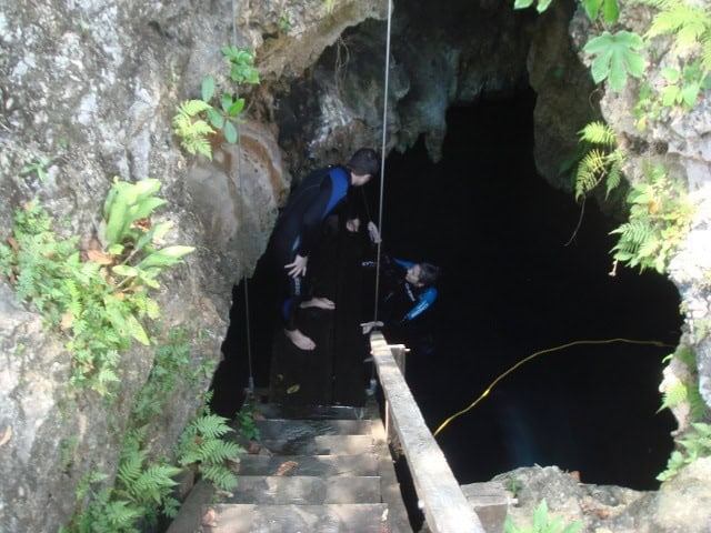 Exiting the cenote after some apres-scuba cliff jumping.