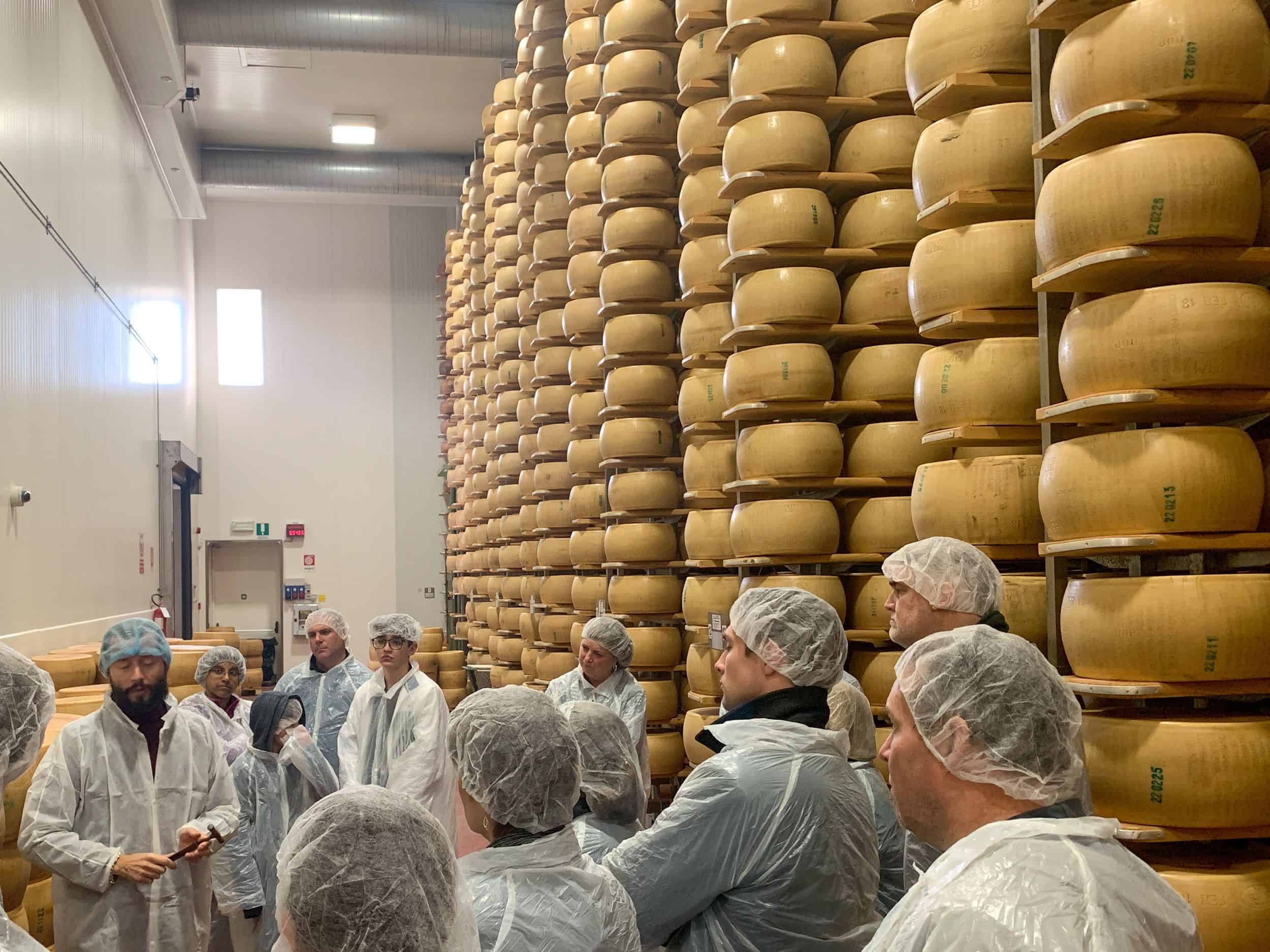 Touring a Parmigiano Reggiano factory is a can't-miss food experience in Emilia-Romagna, Italy.