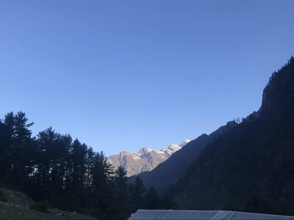 Rays of Sunrise reflecting on the mountains at Kheerganga