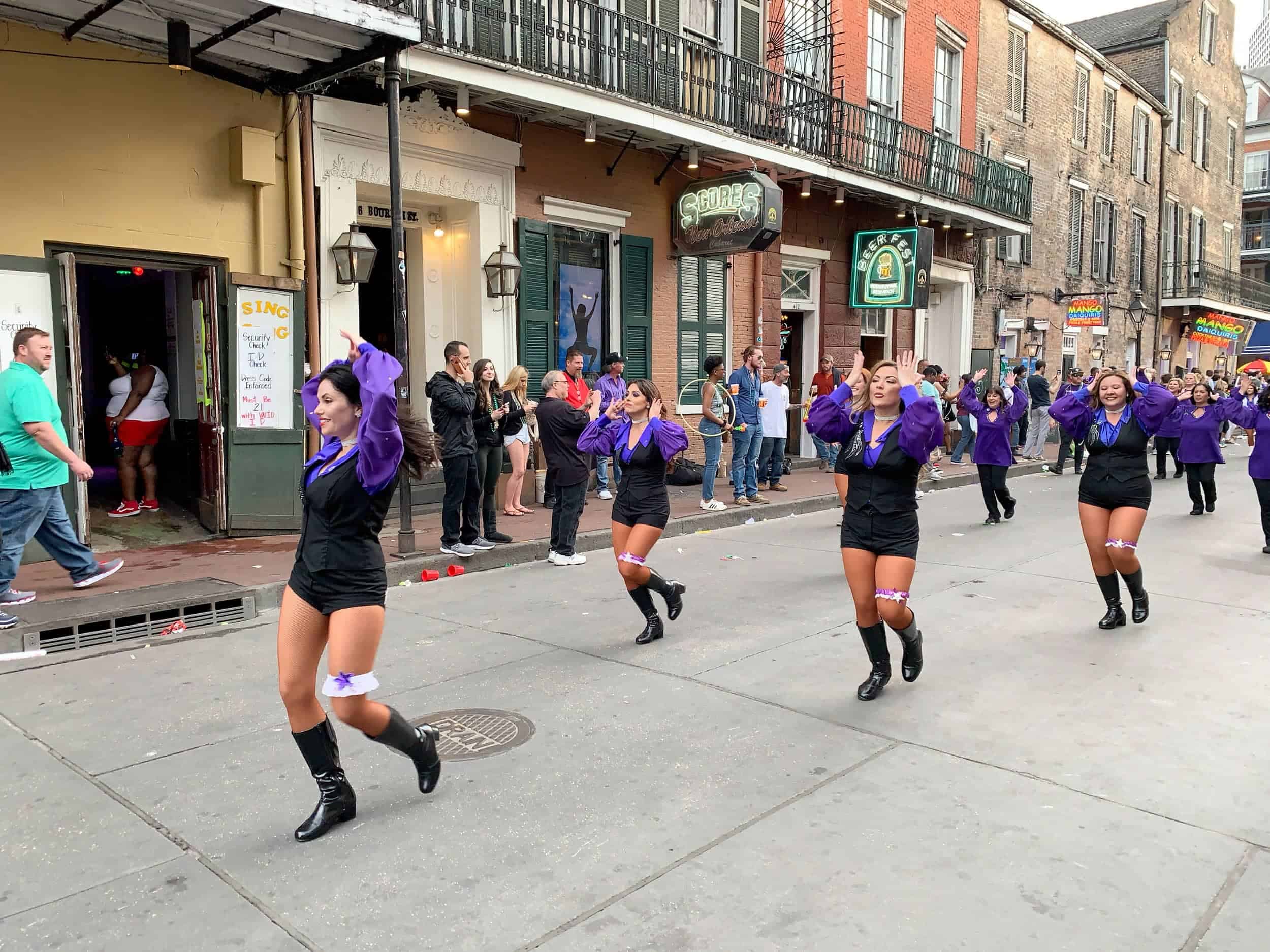 Catching an unexpected parade on Bourbon Street in the French Quarter.