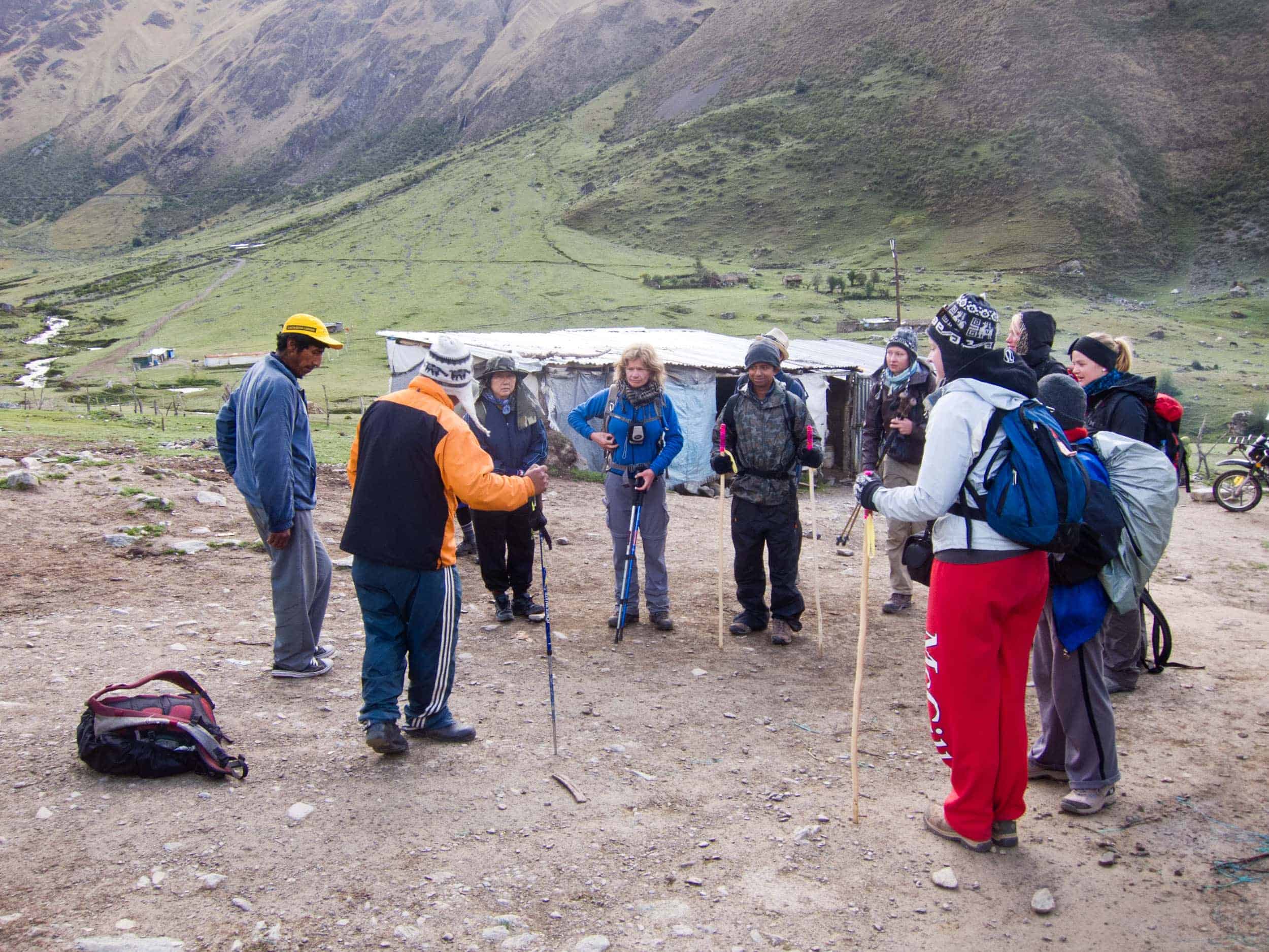 Our guide (orange) briefs us on day two of Salkantay trek to Machu Picchu