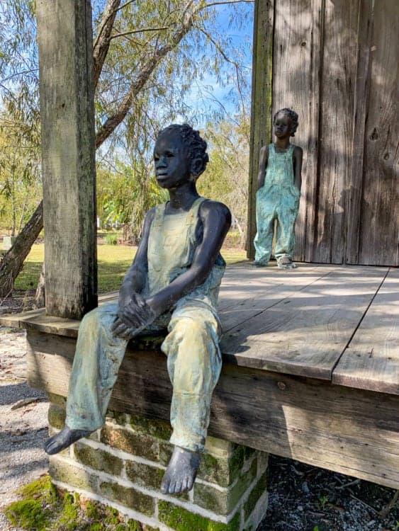 Children of Whitney at a slave cabin