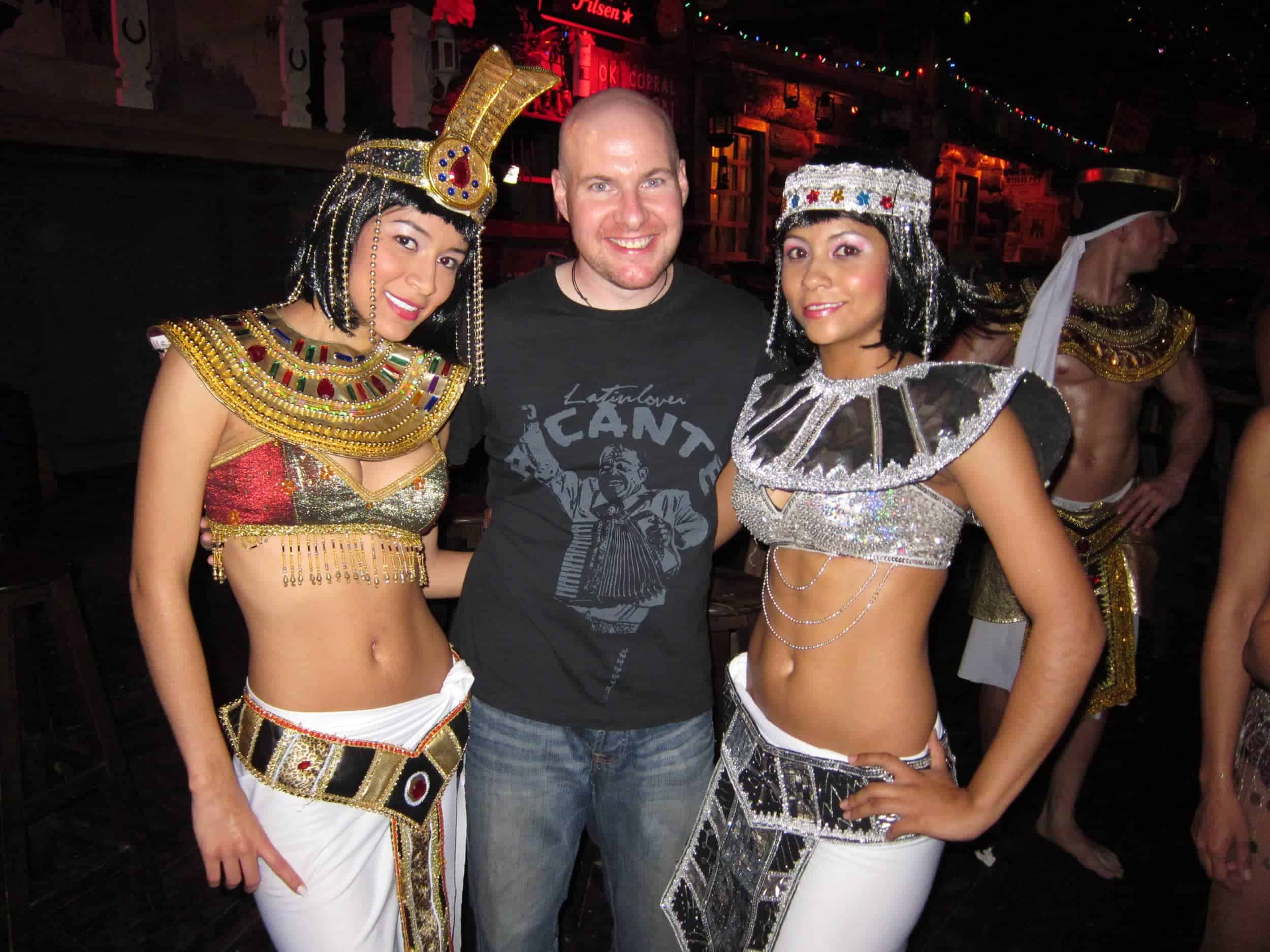 Dave has his picture taken with dancers at a club in Medellin, CO.