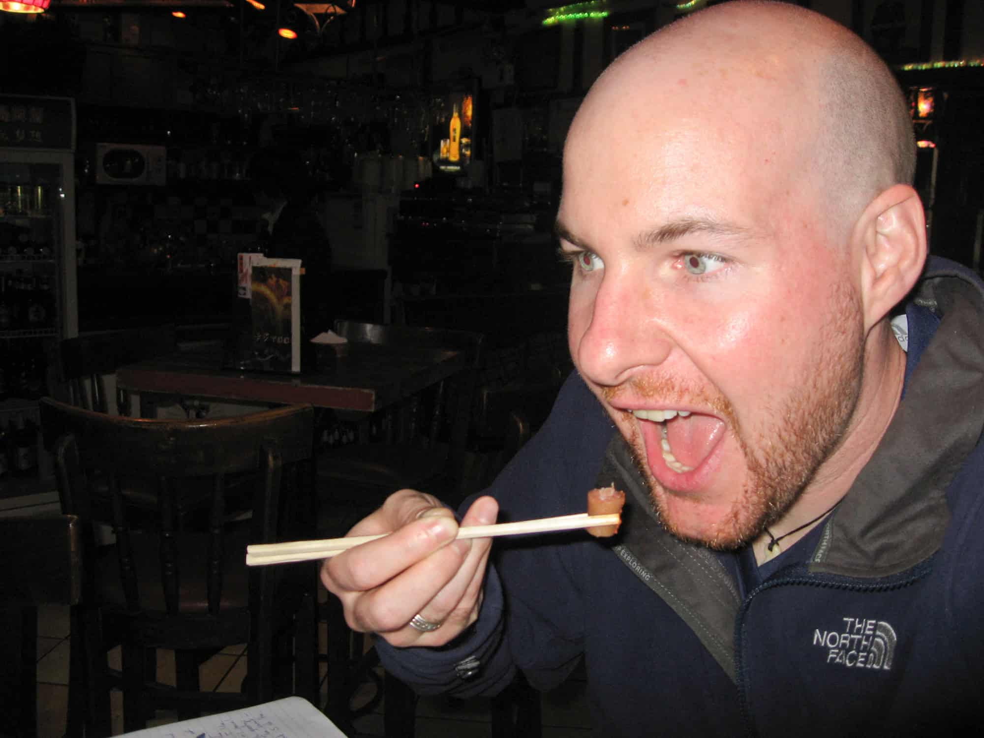 Eating pig's tail in Chengdu, China