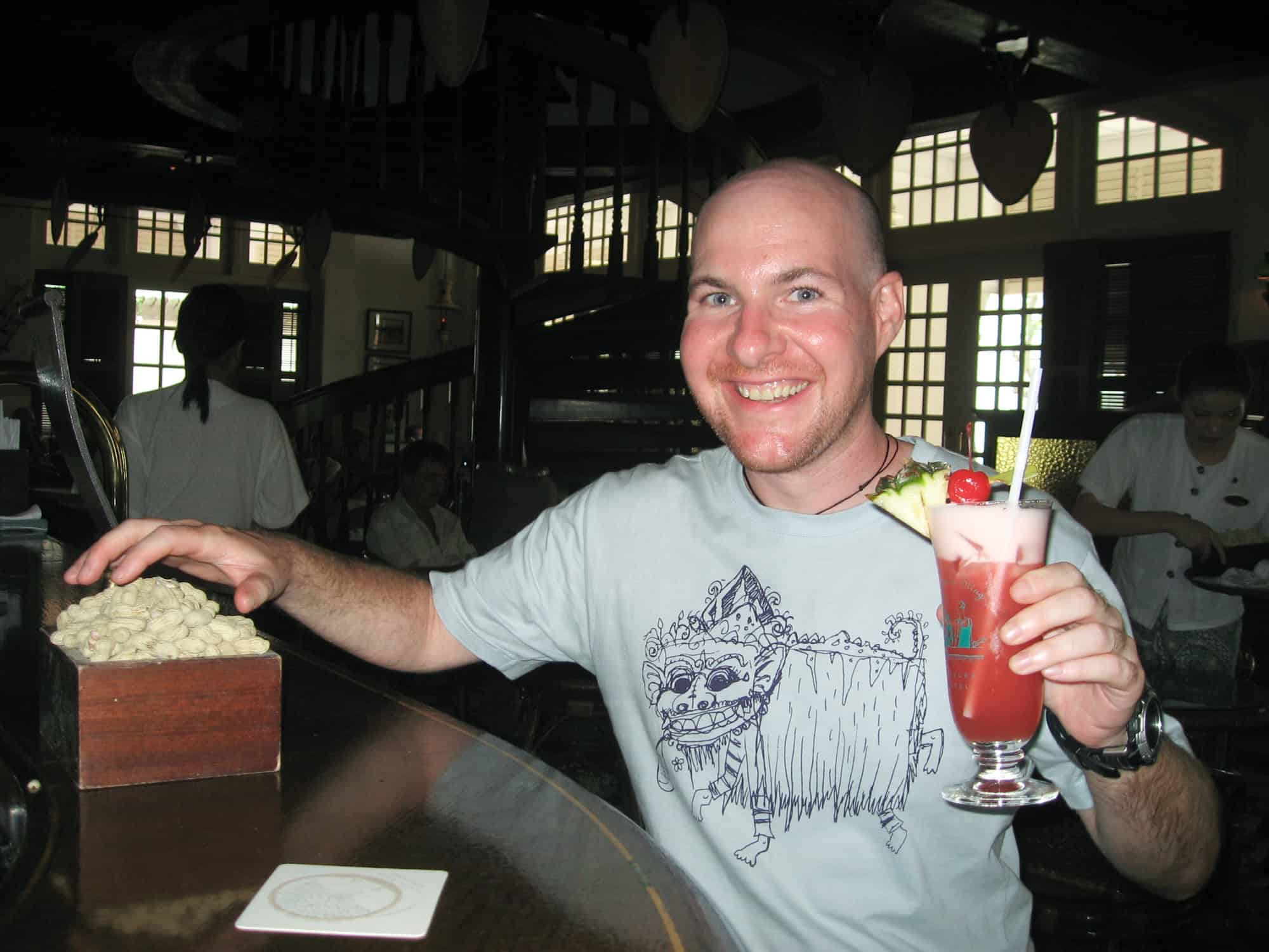 Following in Anthony Bourdain's footsteps with a Singapore Sling at Long Bar in the Raffles Hotel.