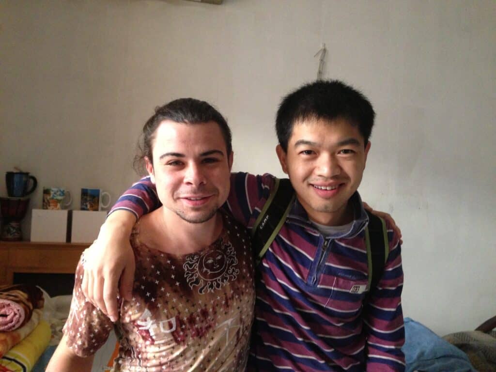 The author (left) and his Couchsurfing host in Beijing, China