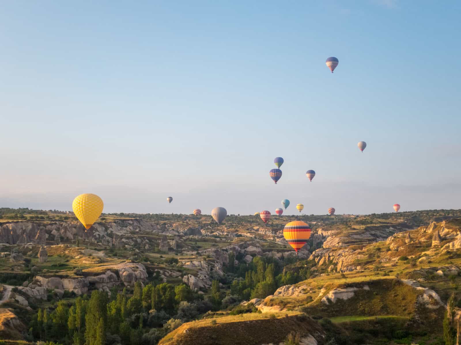 Hot air balloons landing in Cappadocia