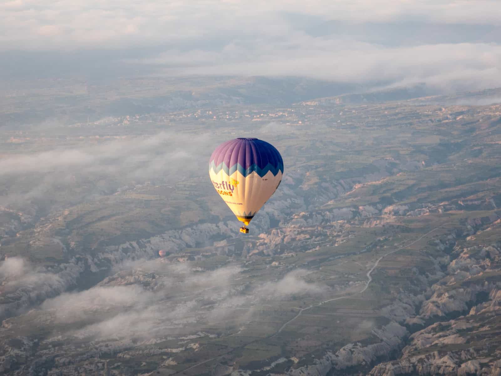 A balloon drifting back to Earth