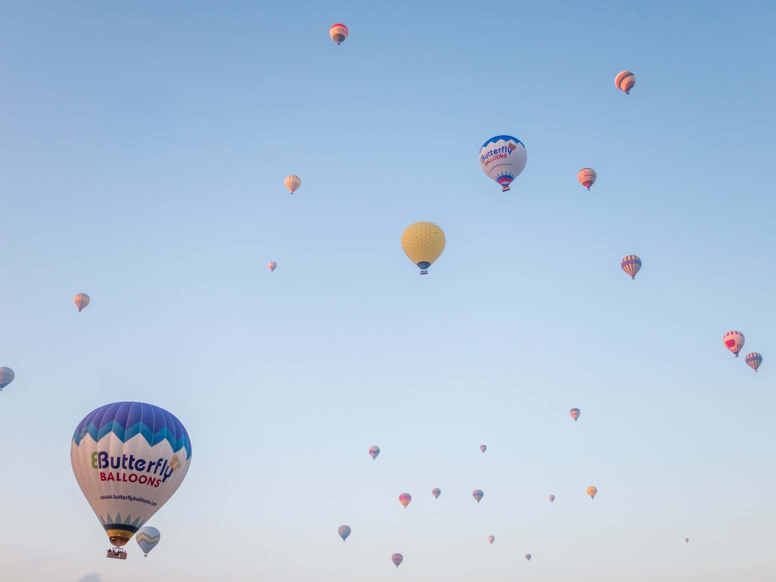 Hot air balloons fill the sky over Cappadocia, Turkey