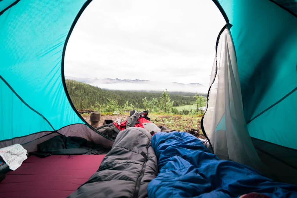 Sleeping bag in tent (photo: Unsplash)