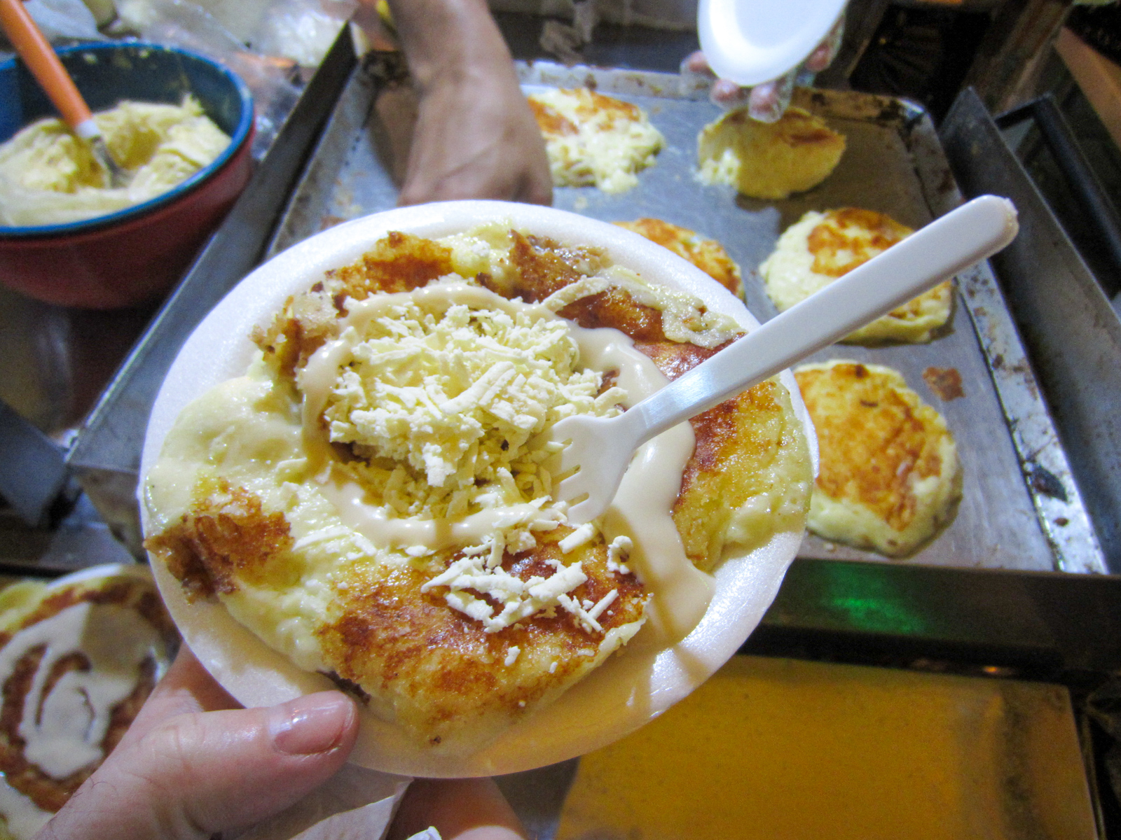 Street arepa with cheese and condensed milk