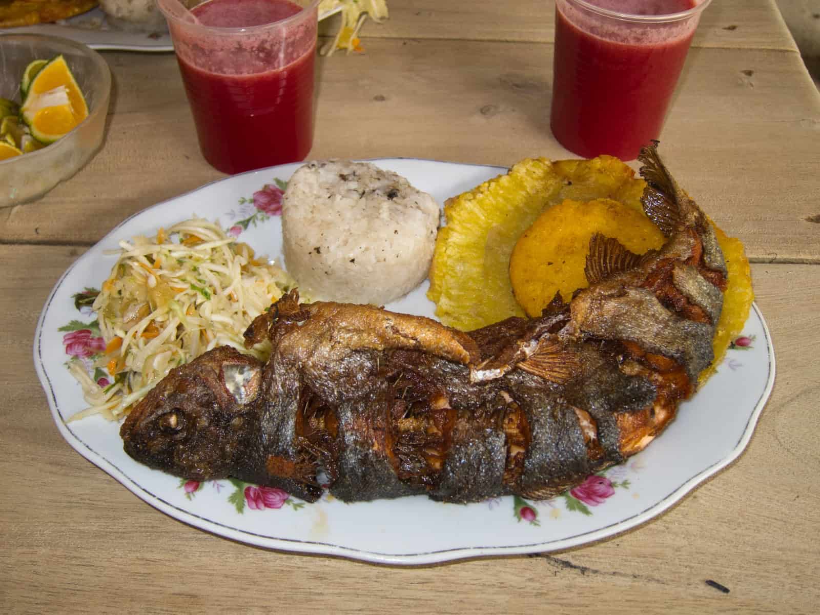 Fried trout, plantains, arepa, and white rice is a standard Colombian food choice.