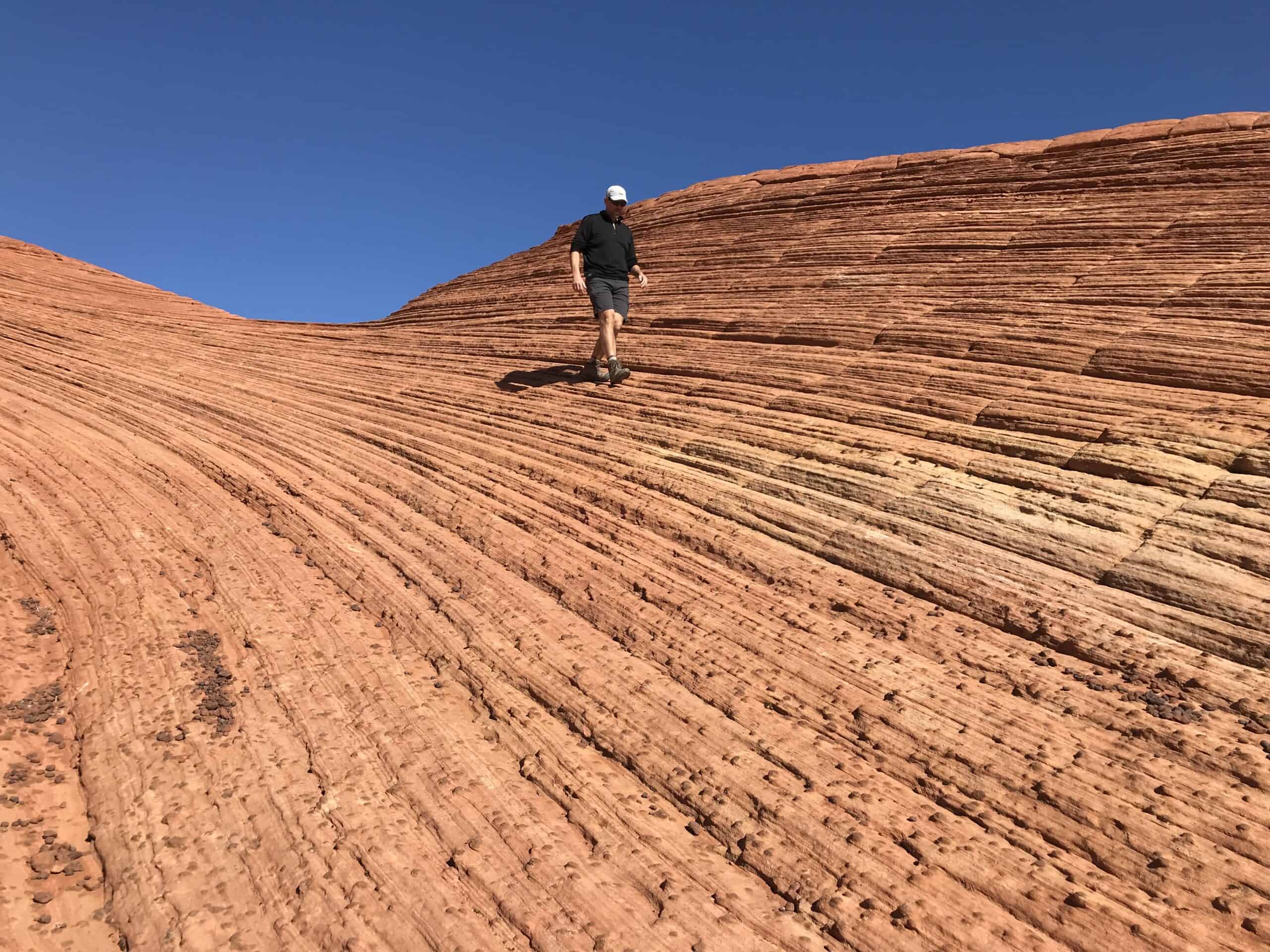 The author walking on red sandstone at Snow Canyon State Park