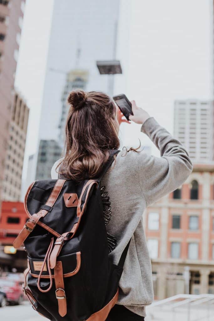 Woman taking a photo with her phone.