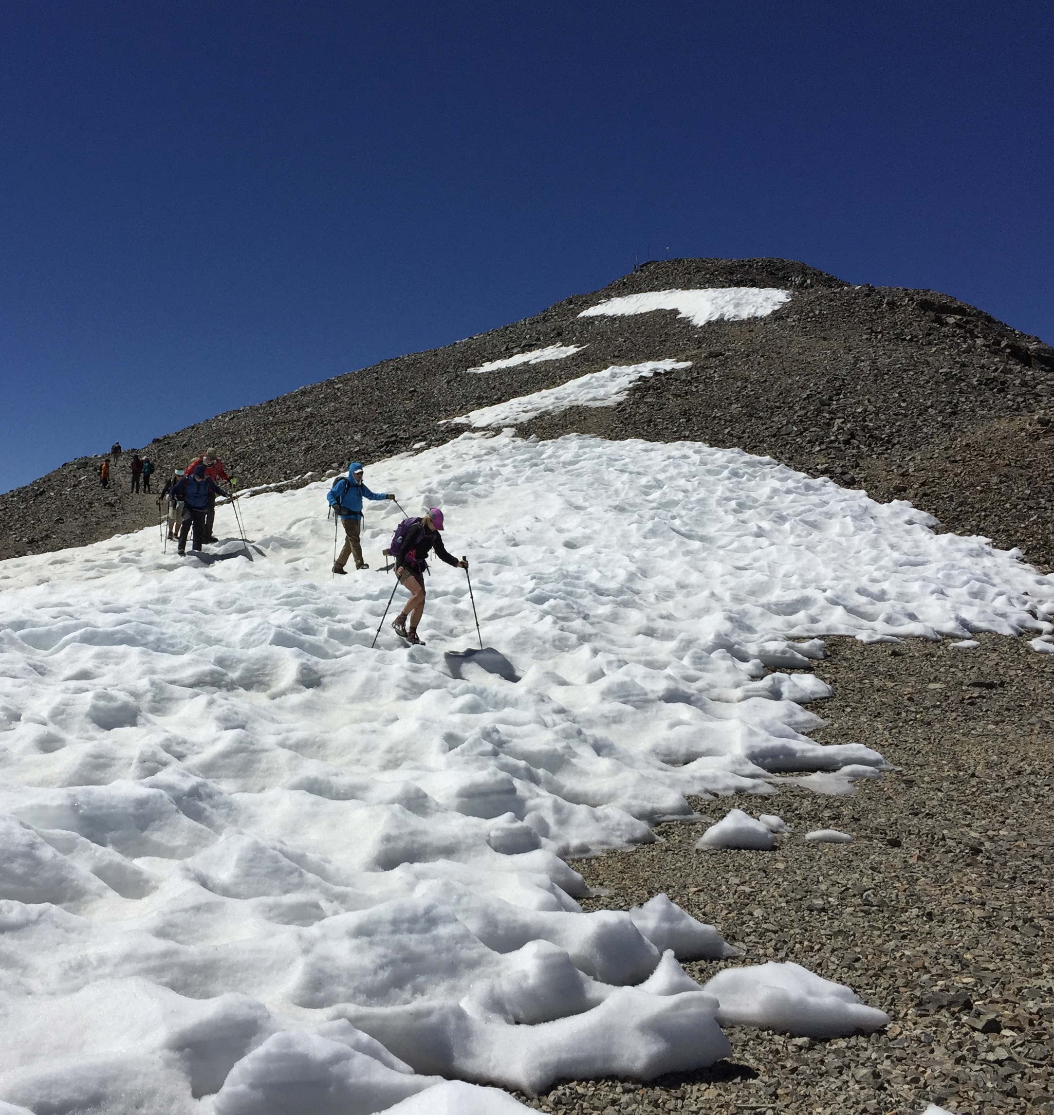 A Sierra Nevada adventure is traversing sun-cupped snowfields on the way down White Mountain Peak