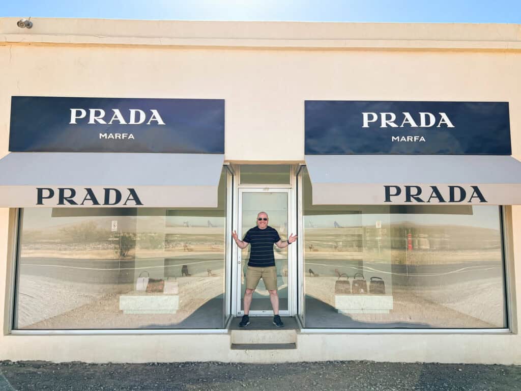 The desert landscape reflected in the windows of the Prada Marfa art installation (photo: Kelly Lemons)