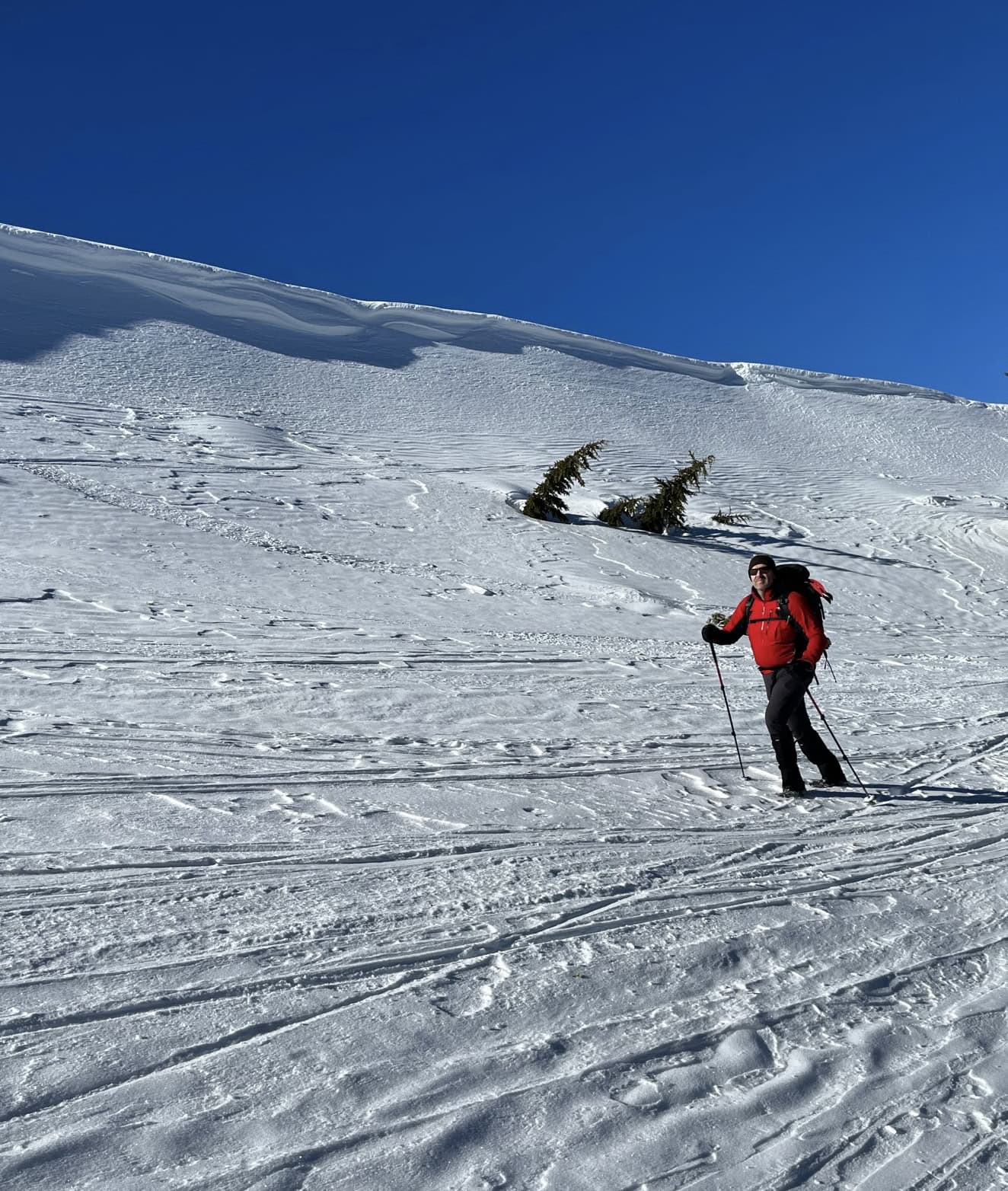 The author moving down the mountain under a wave of snow.