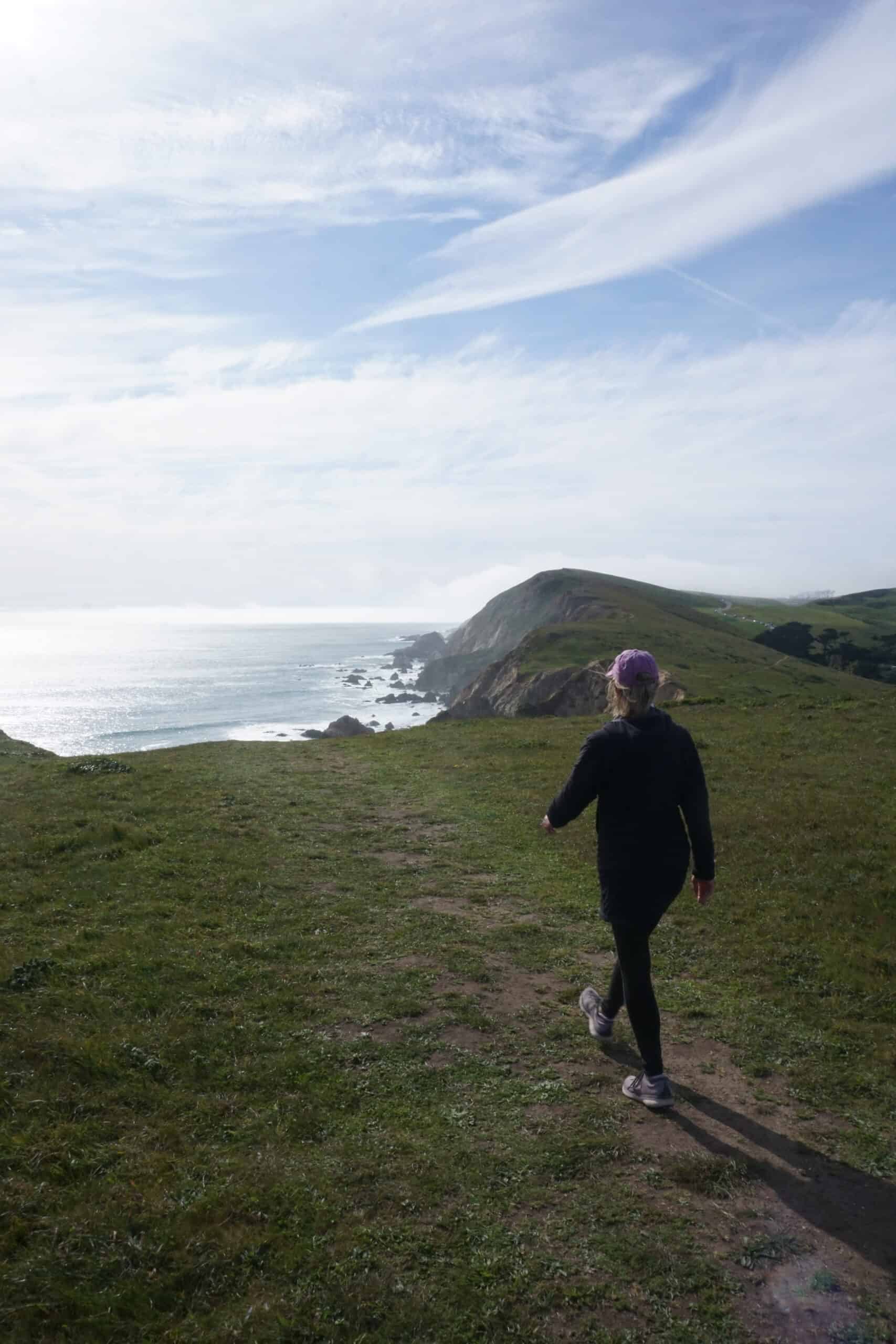 CT strides toward a cliff in Point Reyes National Seashore