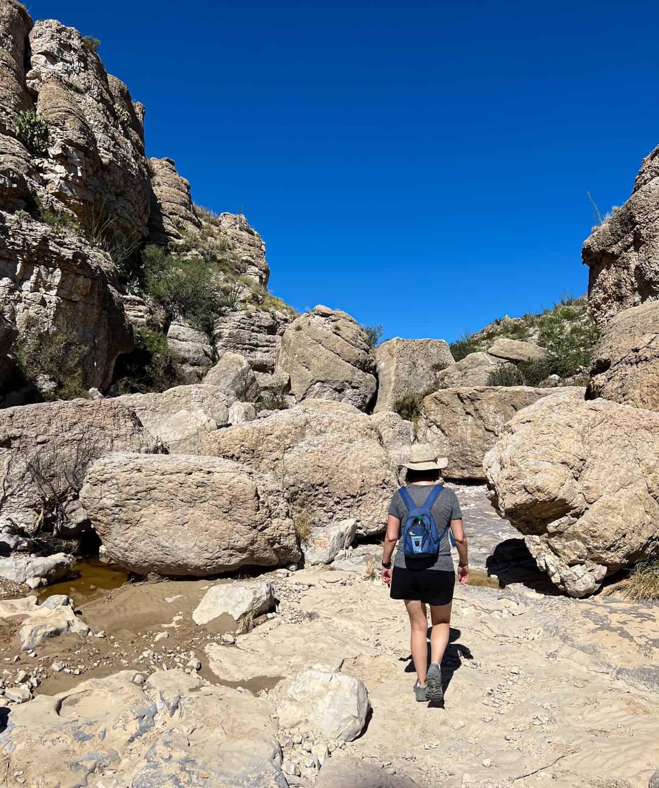 Kel hiking amid boulders to Big Bend hot springs.