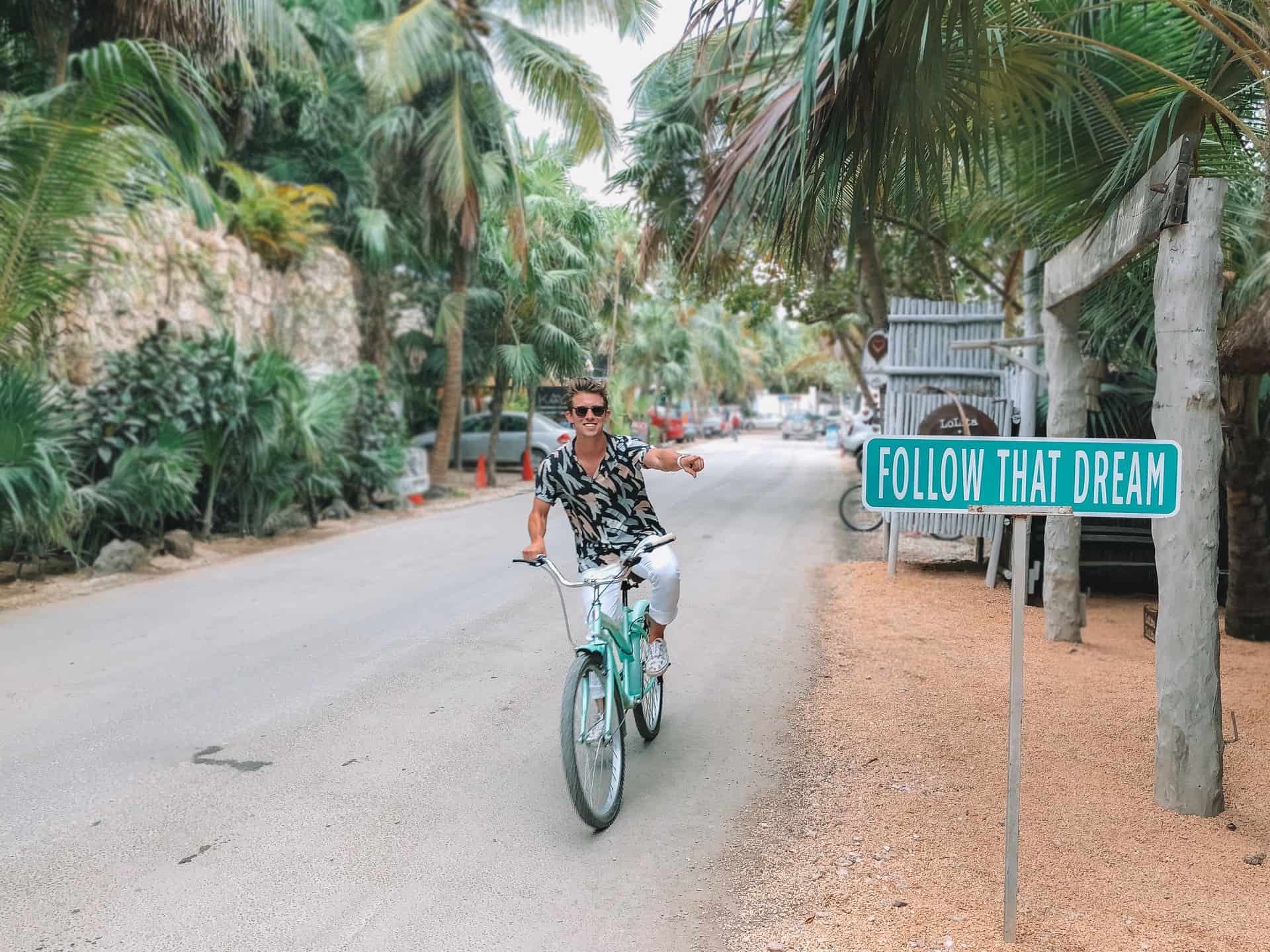 Entrepreneur Austin Distel bicycles in Tulum, Mexico