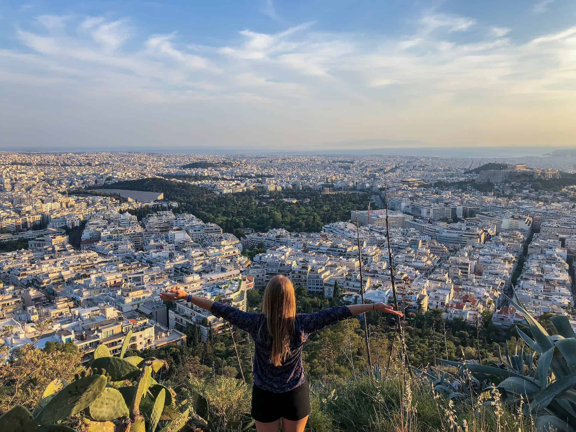 A female traveler looking out over Athens, a top city for digital nomads (photo: Kristin Wilson)