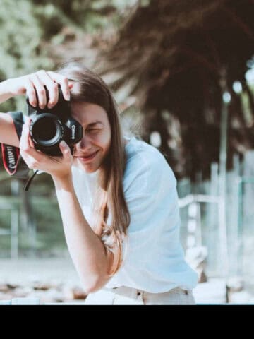 Woman using a Canon camera (photo: Lisa Fotios).