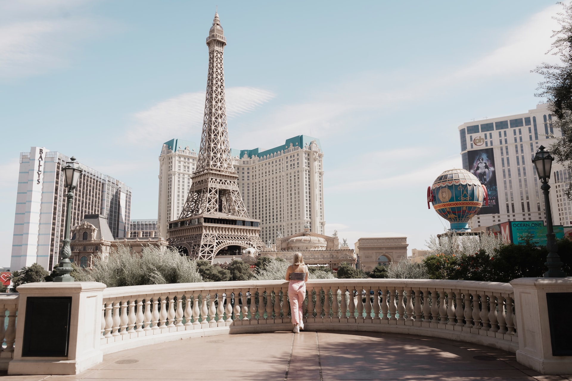 A woman looks at the Eiffel Tower (photo: Crosby Hinze)