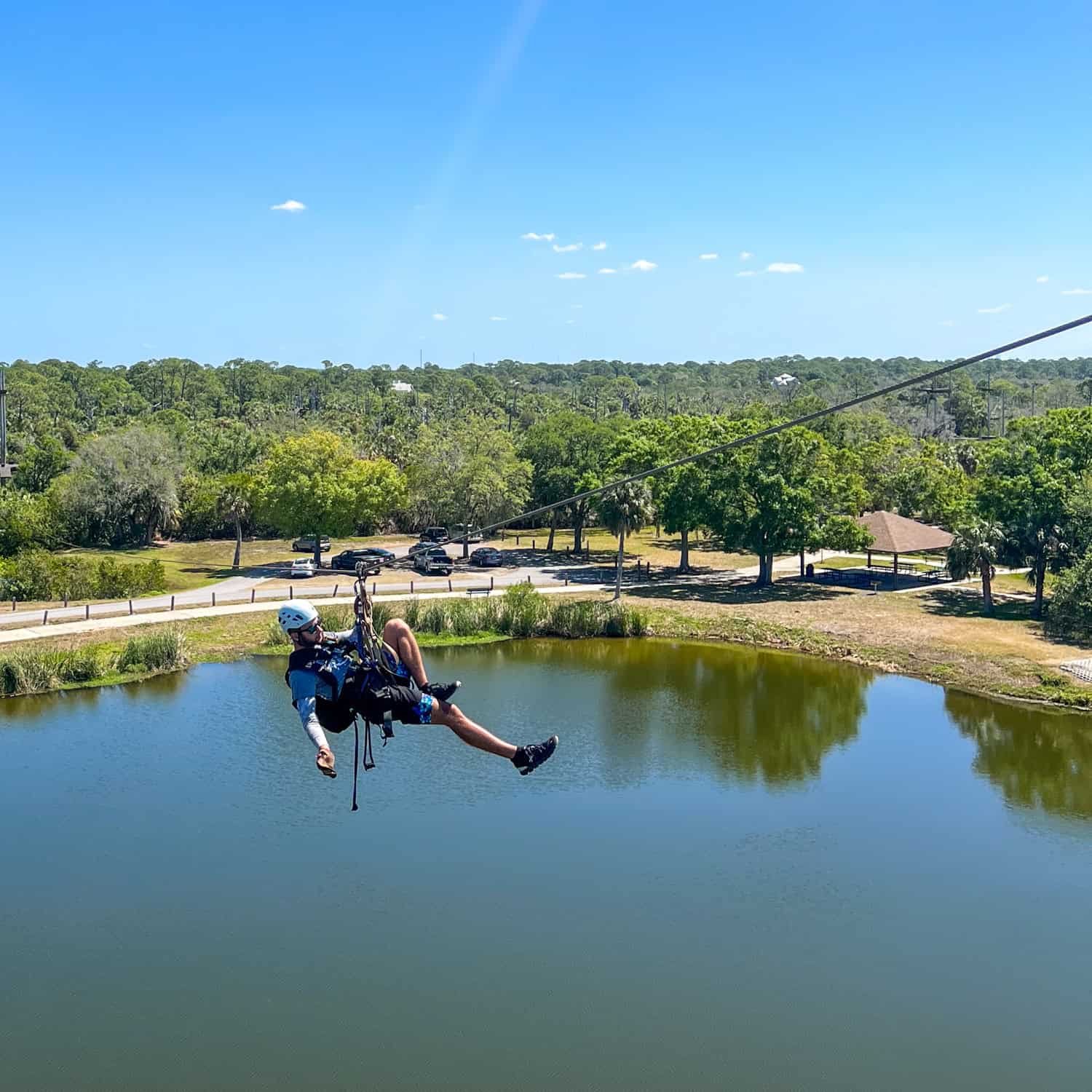 Alex, a zipline guide at Empower Adventures, one of the best places to go for outdoor activities in Tampa