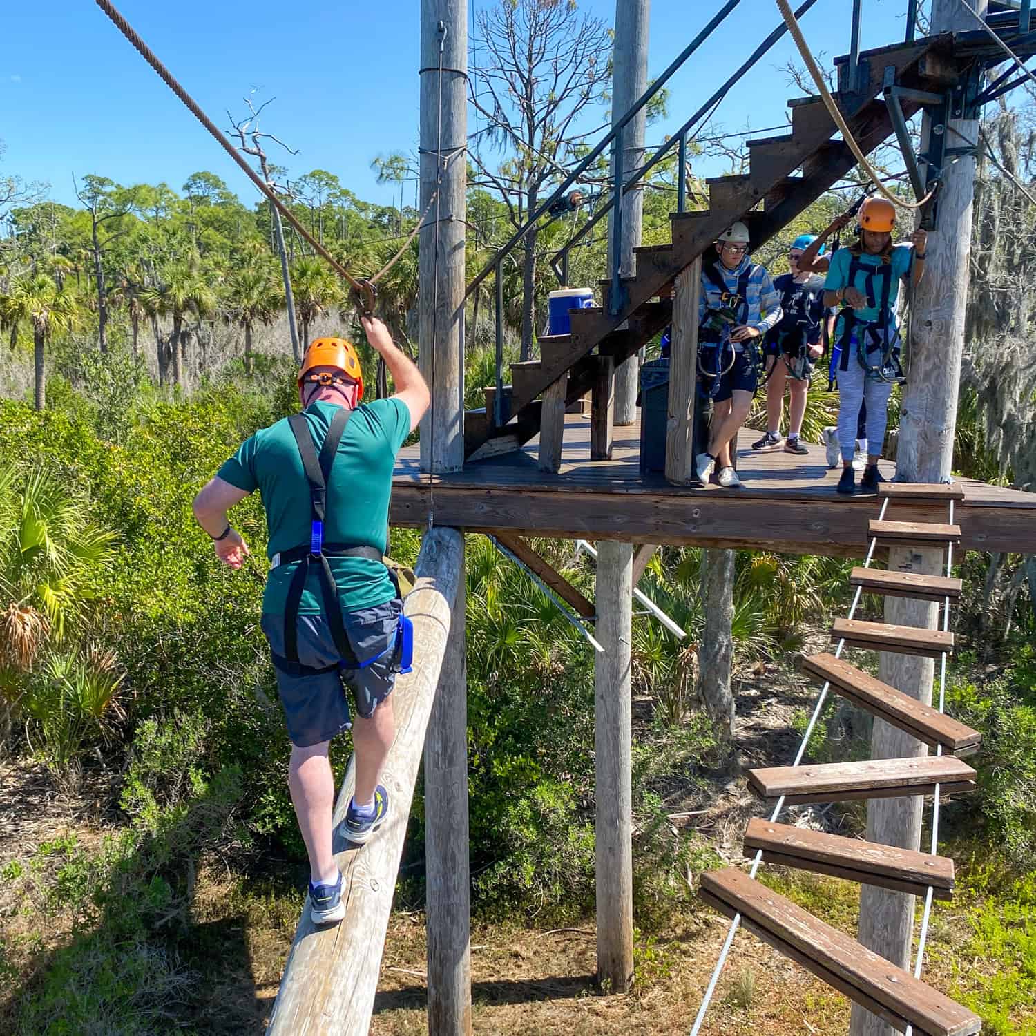 Walking gingerly down a wobbly log