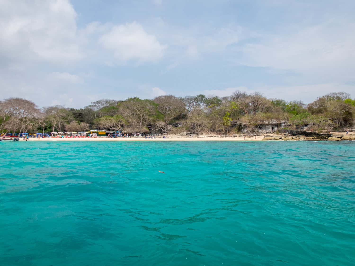 The turquoise waters off Playa Blanca, which we visited on a boat tour from Cartagena