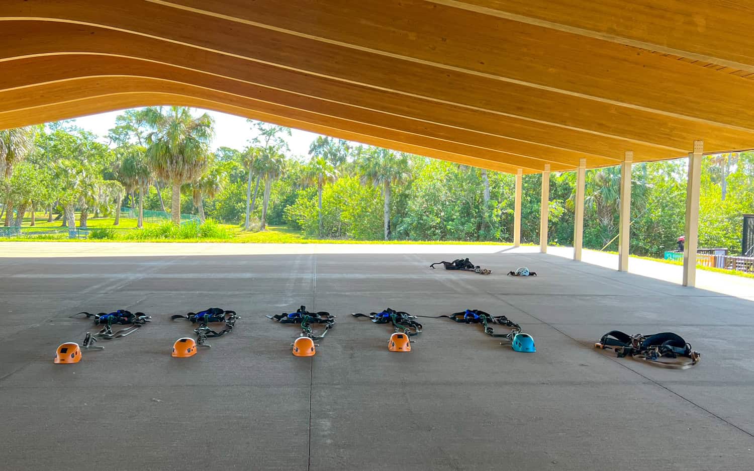 Harnesses and helmets for ziplining