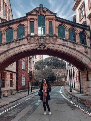 A woman poses on a street in Oxford, England (photo:Lucia Hatalova).