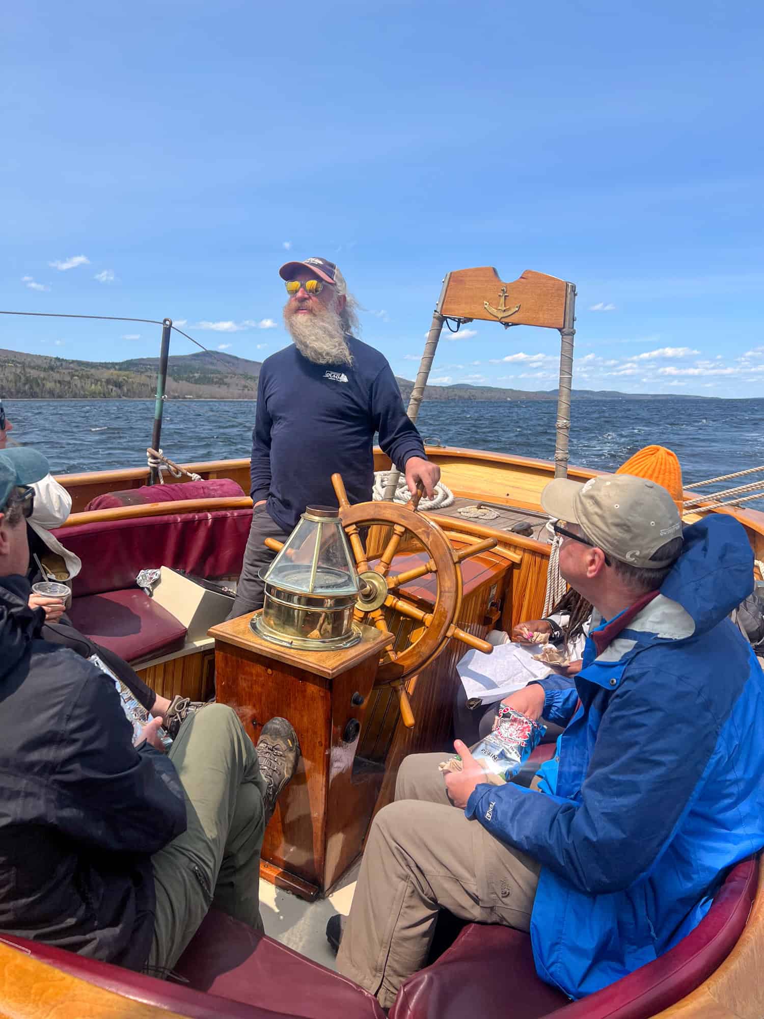 Captain Aaron Lincoln at the helm of Schooner Olad