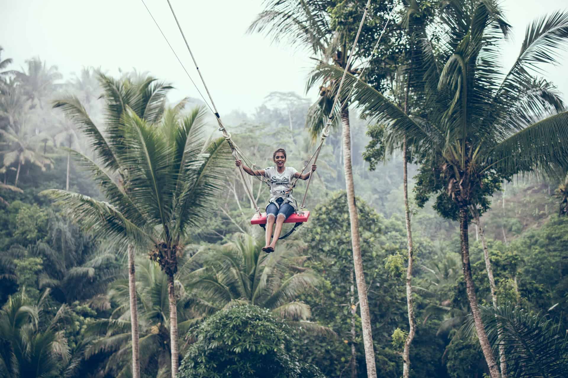 A woman swinging in Bali (photo: Artem Beliaikin)