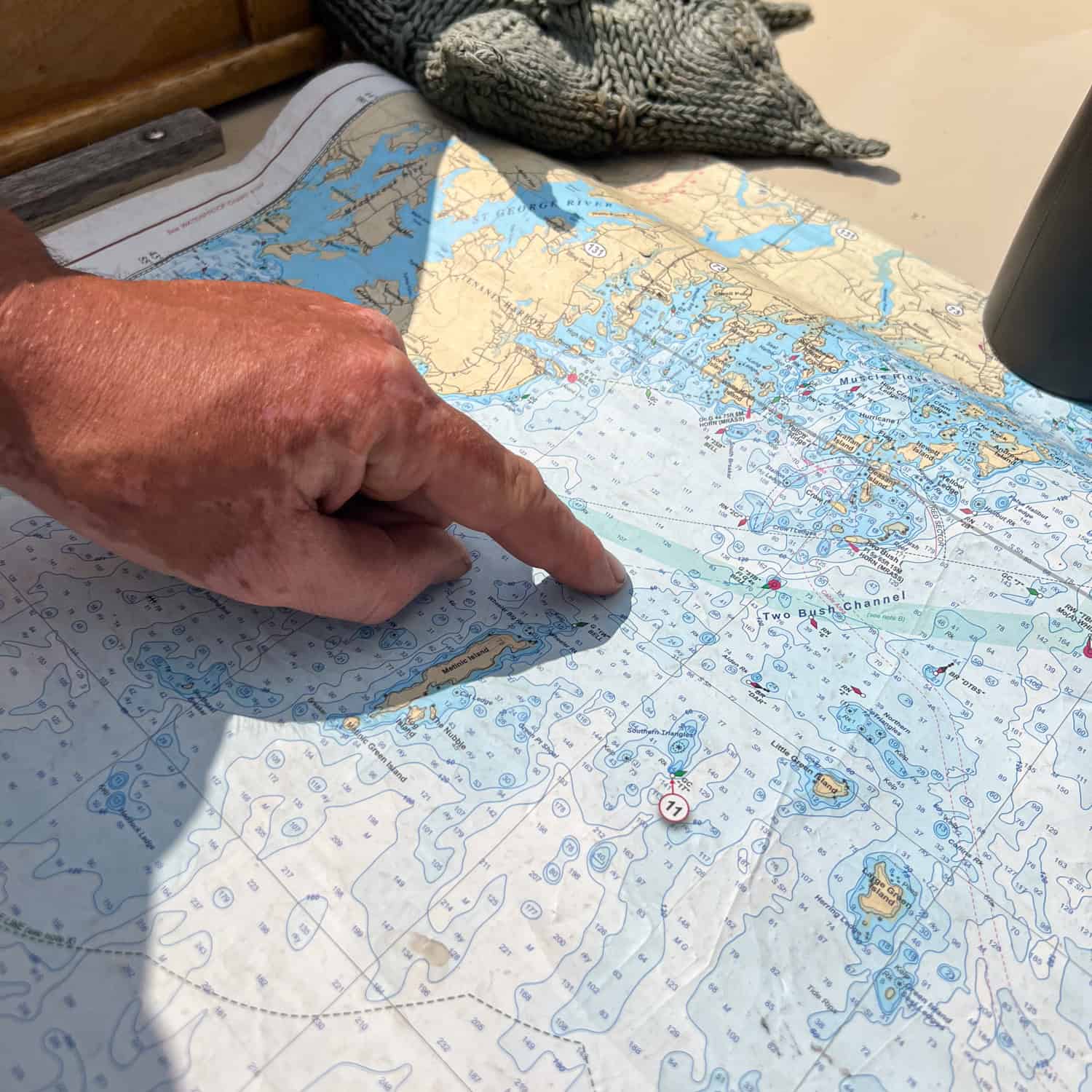 The Captain outlines our route on a nautical map of Penobscot Bay