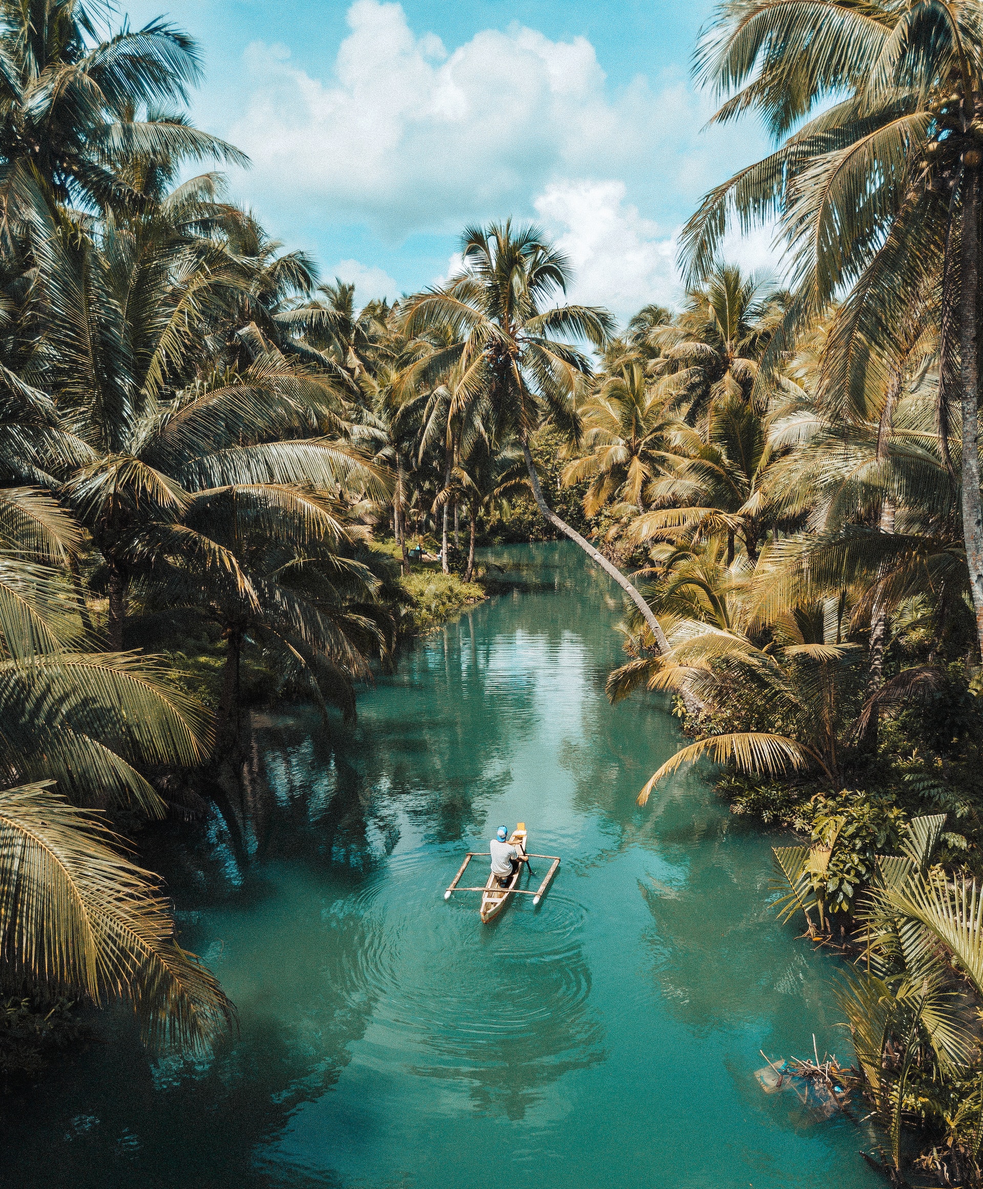 Paddling a boat around Siargao Island in the Philippines (photo: Rolands Varsbergs)