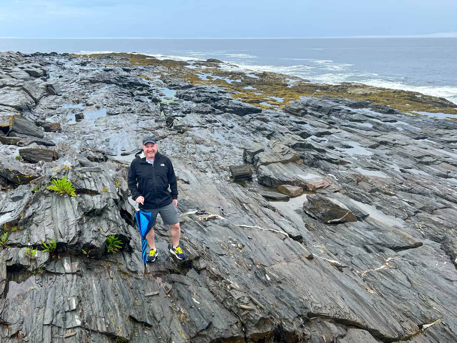 Dave standing on the rocky coast of Cape Elizabeth (photo by Kelly Lemons)