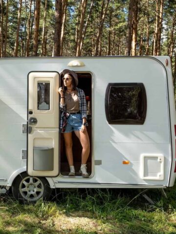 Woman in a caravan (photo: Getty Images via Unsplash+ license).