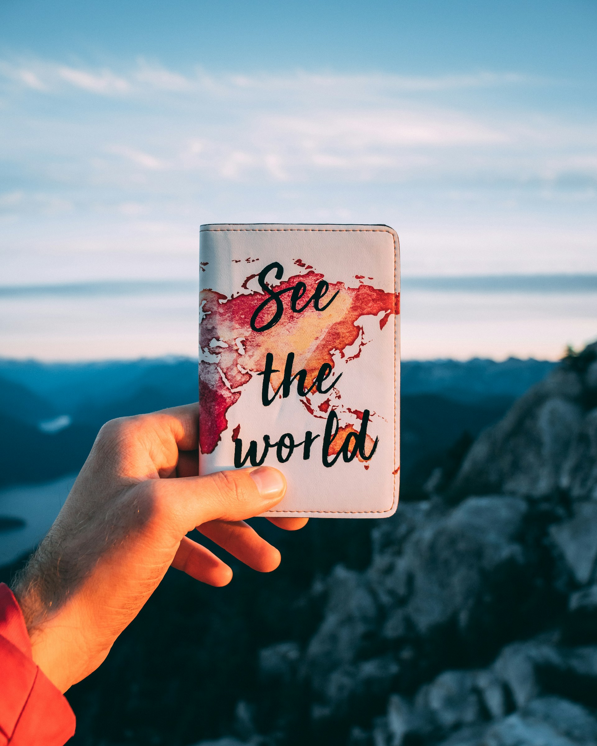 "See the World" custom passport cover, a product you can create yourself with print on demand services. (photo: WanderLabs, Unsplash)