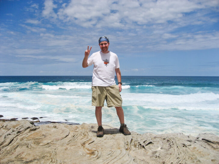 Debt-free and happy on a coastal walk in Sydney, Australia.