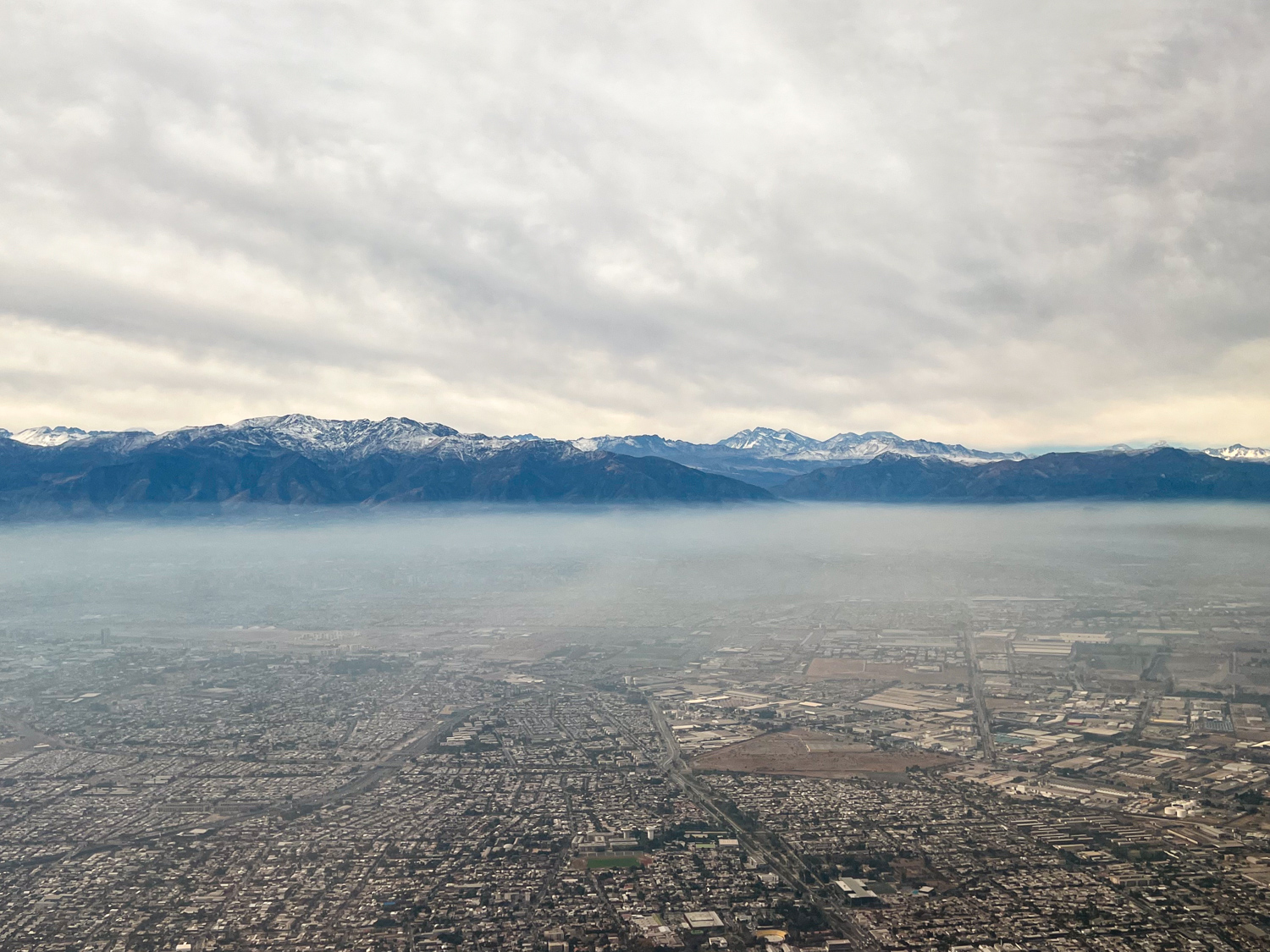 Snow-capped mountains come into view during takeoff from Santiago, Chile (photo by Kelly Lemons).