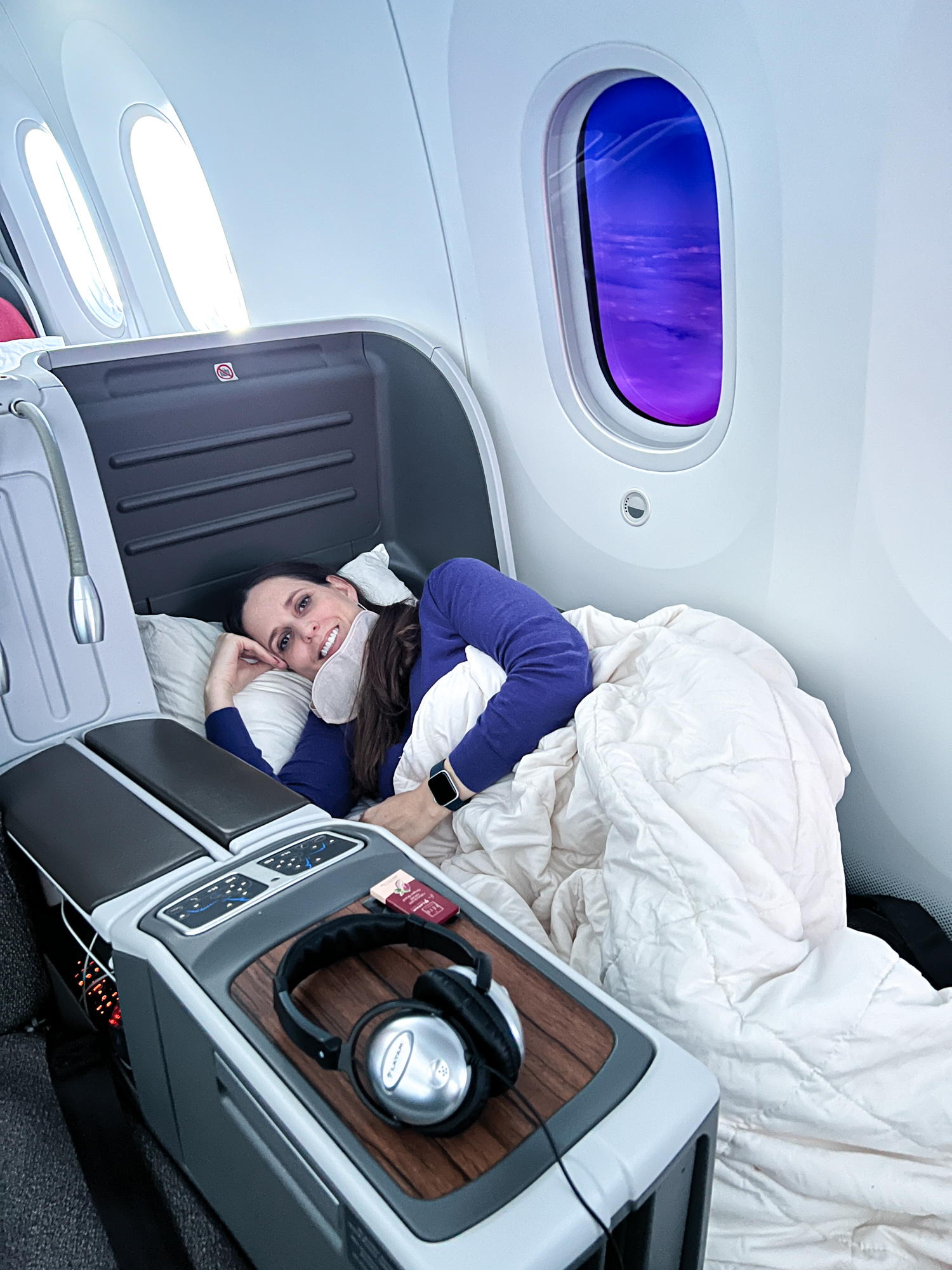 Kel demonstrates the lie-flat seats in LATAM Business Class during our flight to Easter Island.