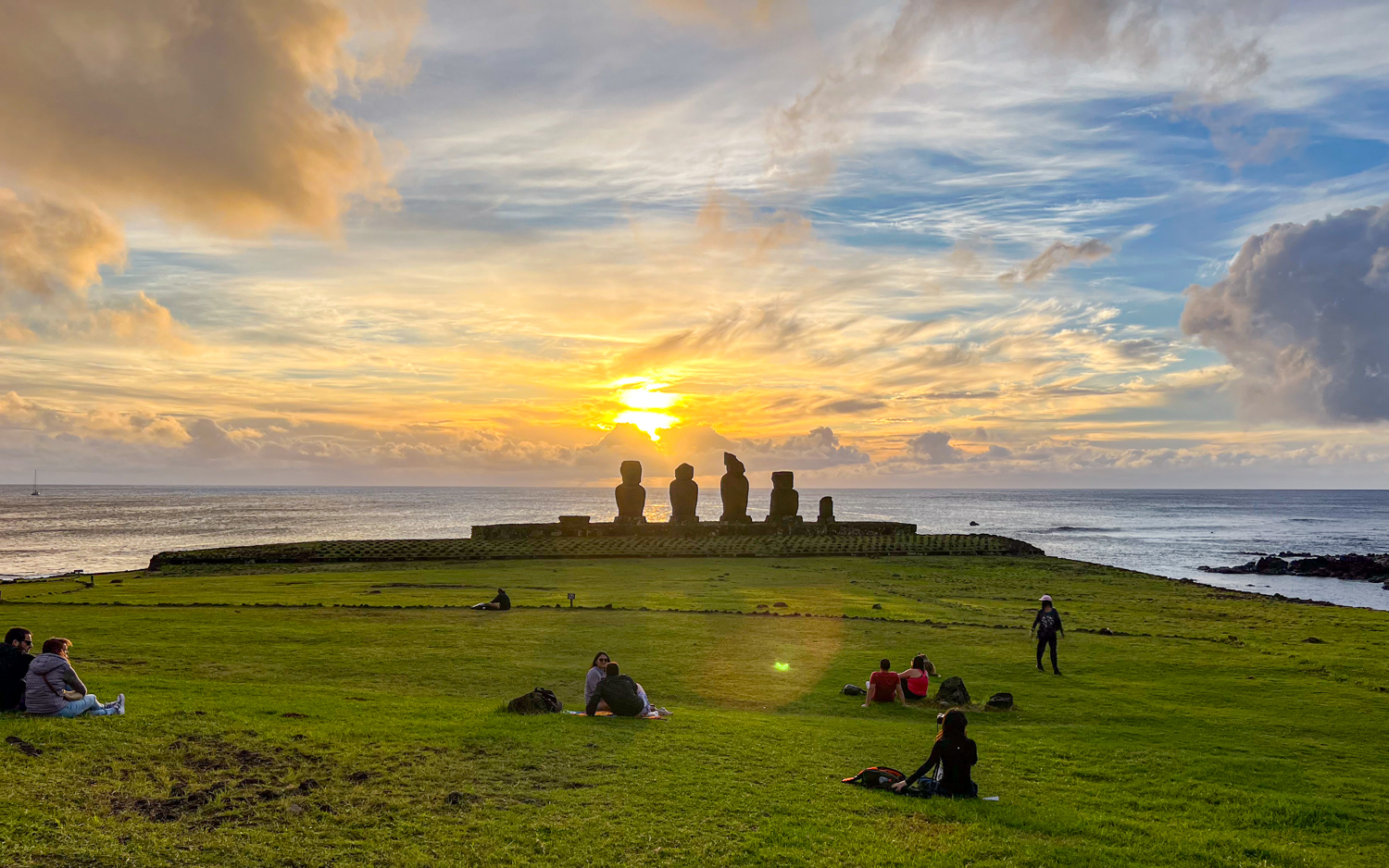 Sunset behind Ahu Vai Uri at the Tahai Ceremonial Complex on Easter Island.