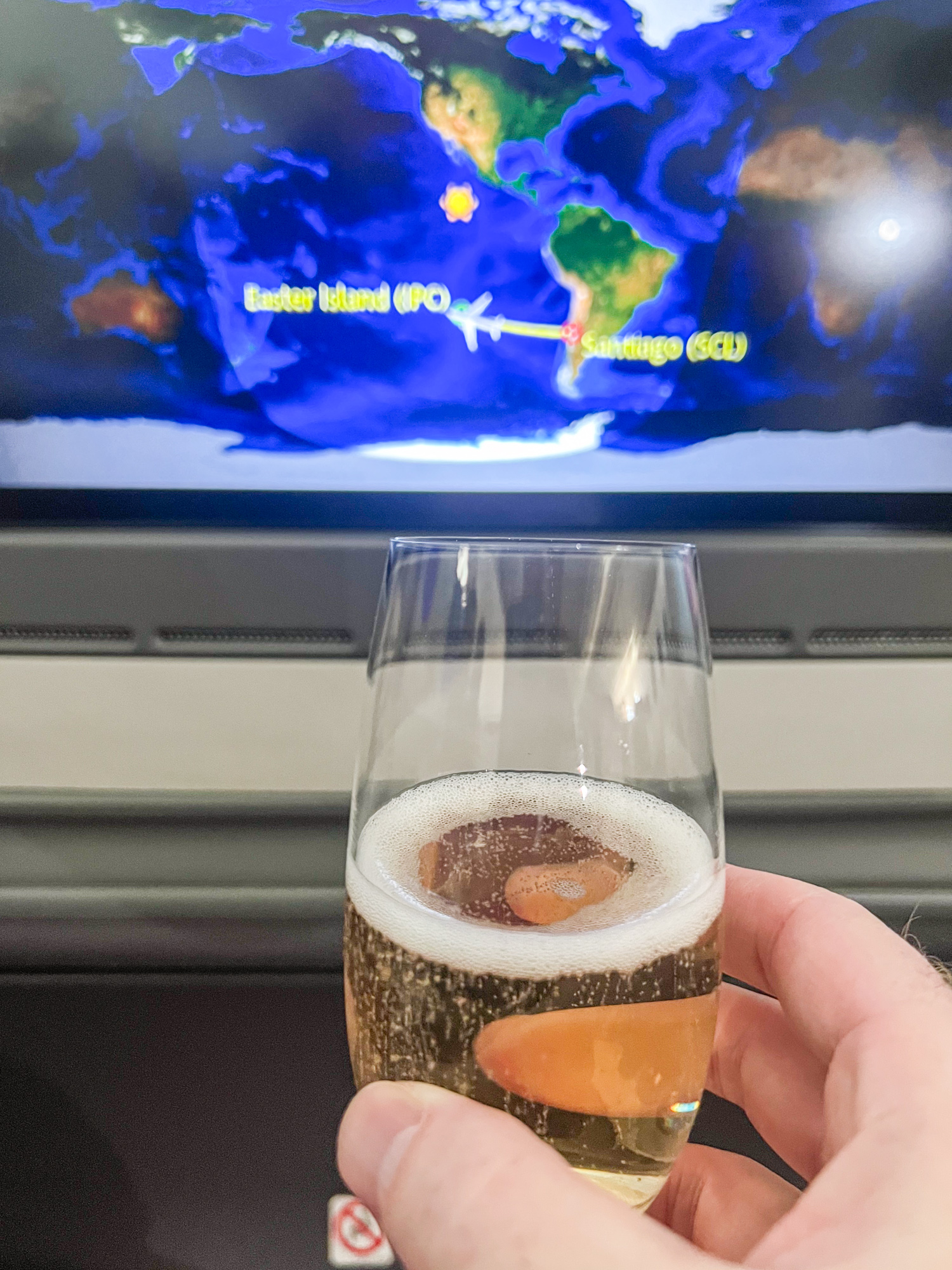 Glass of Champagne Vollereaux Brut Reserve in LATAM Business Class as we approach Easter Island.