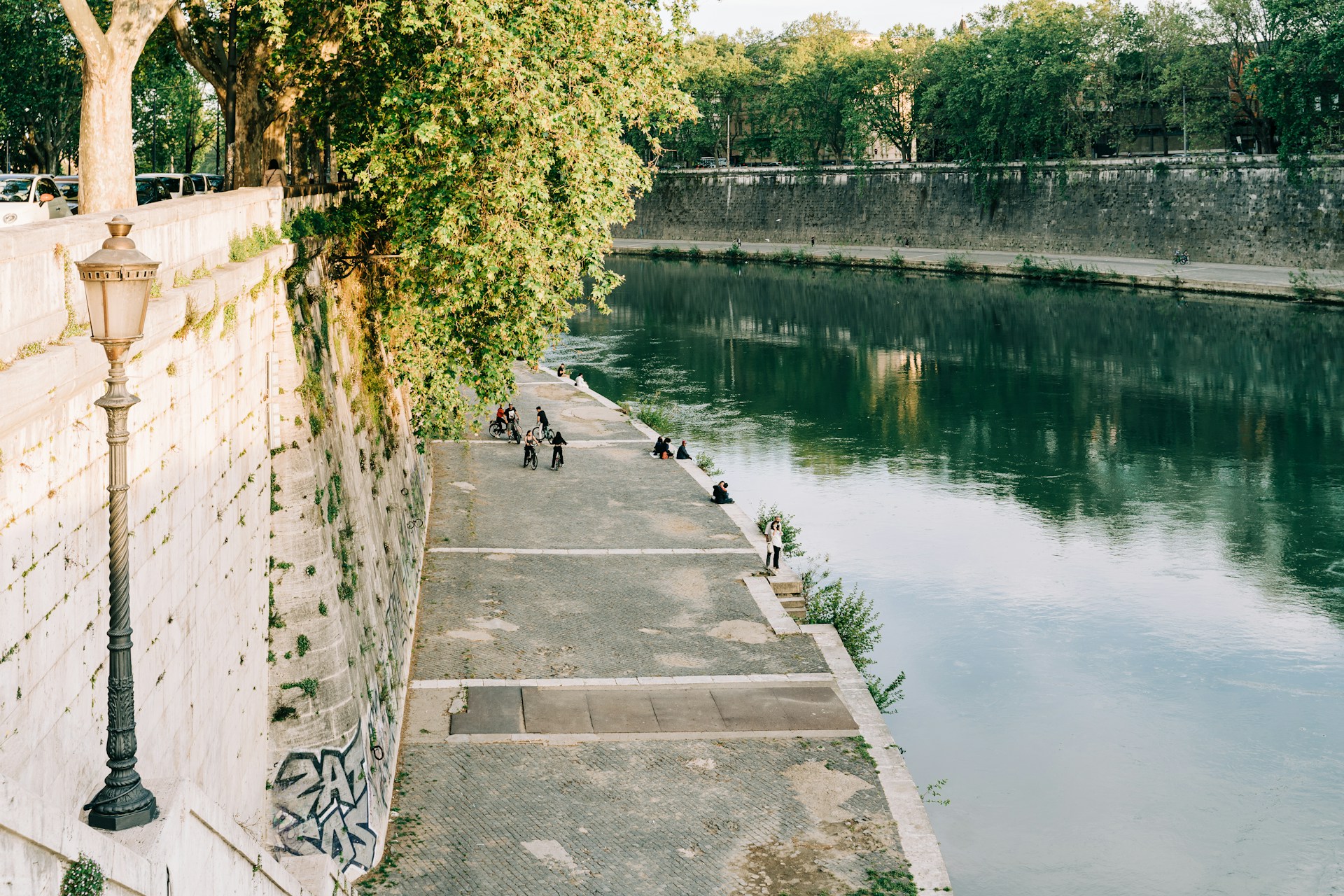 People walking and biking along the Tiber River in Rome (photo: Gabriella Clare Marino).