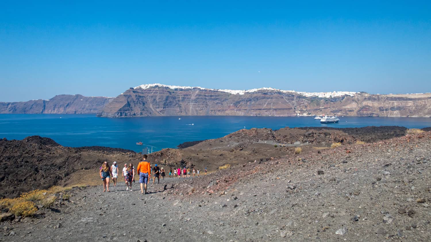 Hikers on Tholos Naftilos Volcano.