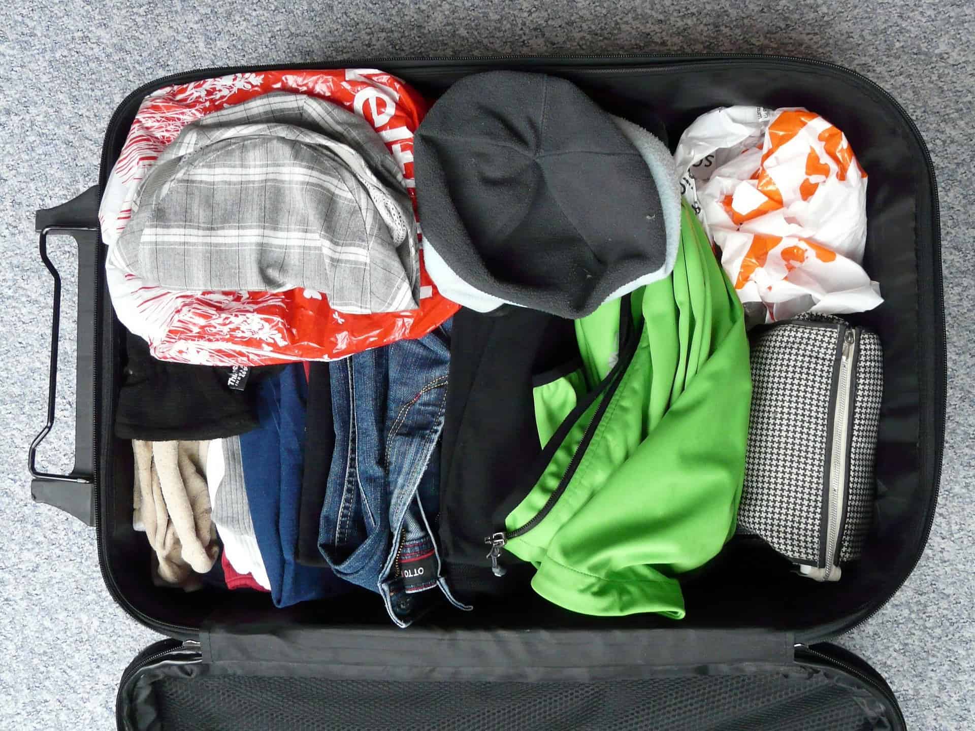 Packed luggage for a road trip (photo by Hans, Pixabay).