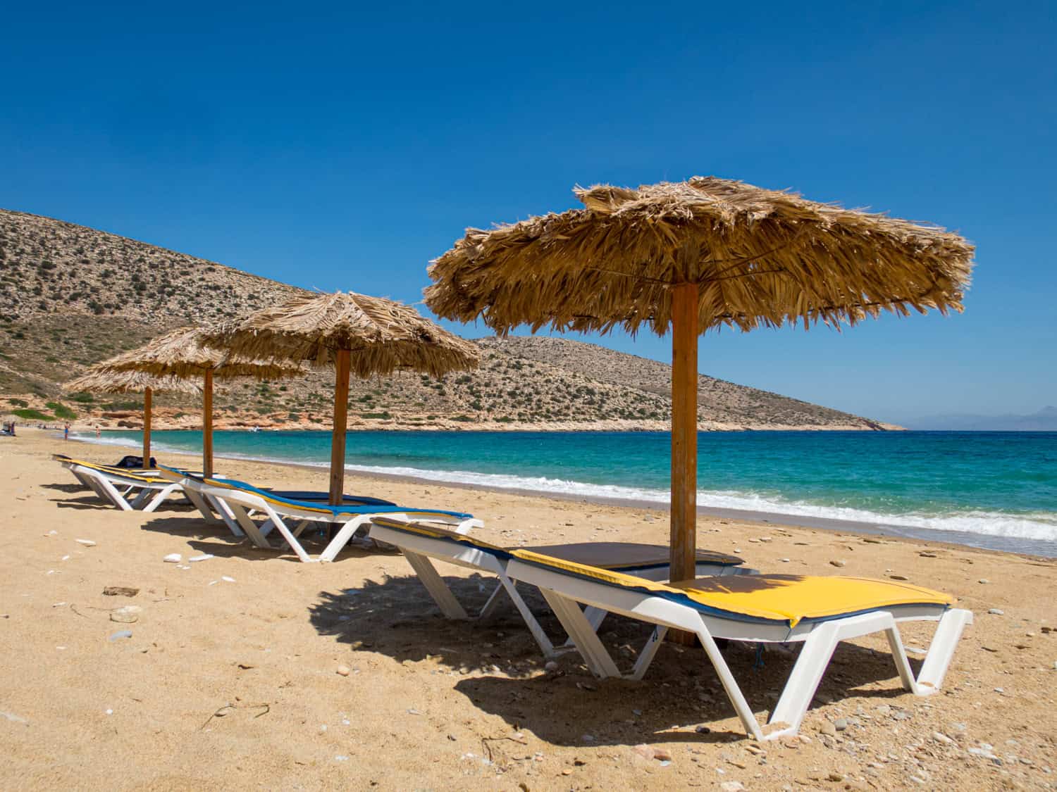 Sun loungers and umbrellas on Agia Theodoti Beach.