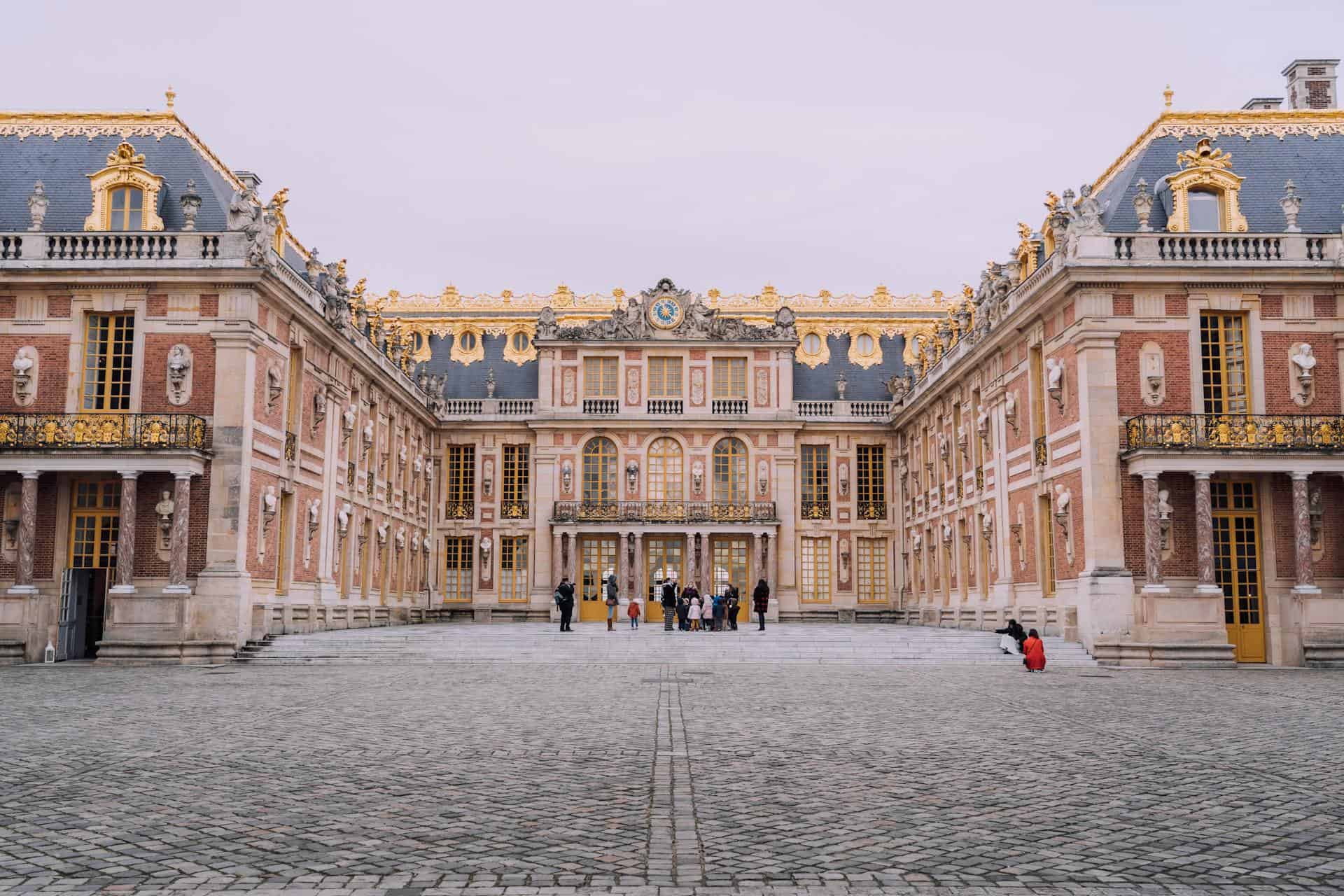 Marble courtyard at the Palace of Versailles (photo by Joan Costa, Pexels).